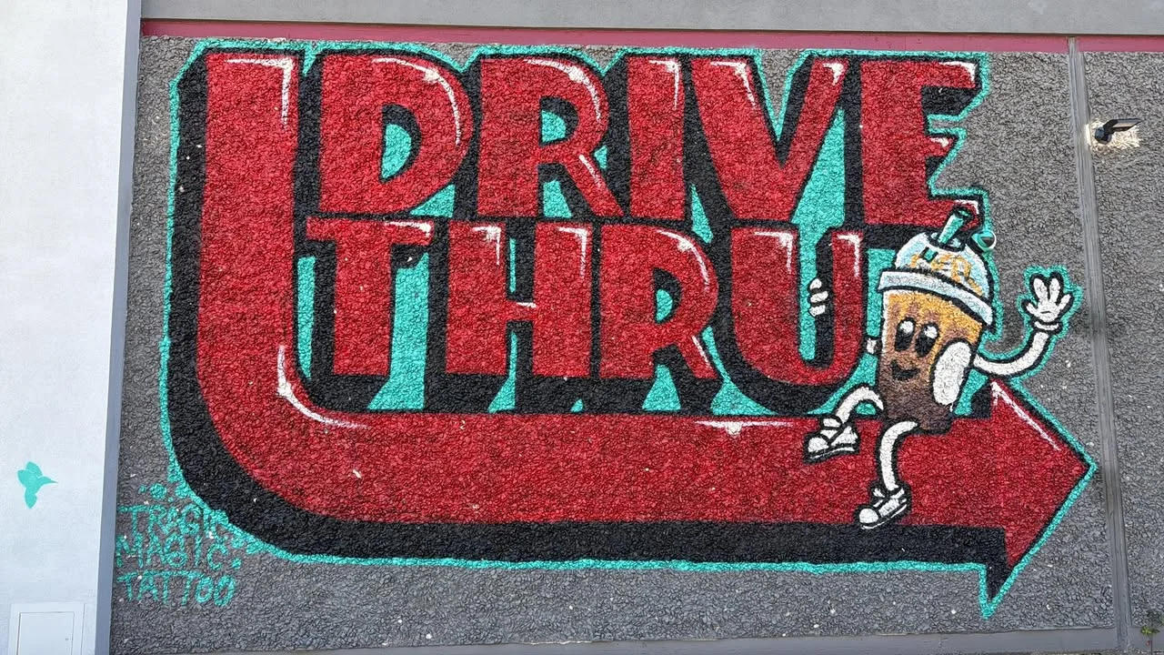 Colorful drive-thru mural with playful design