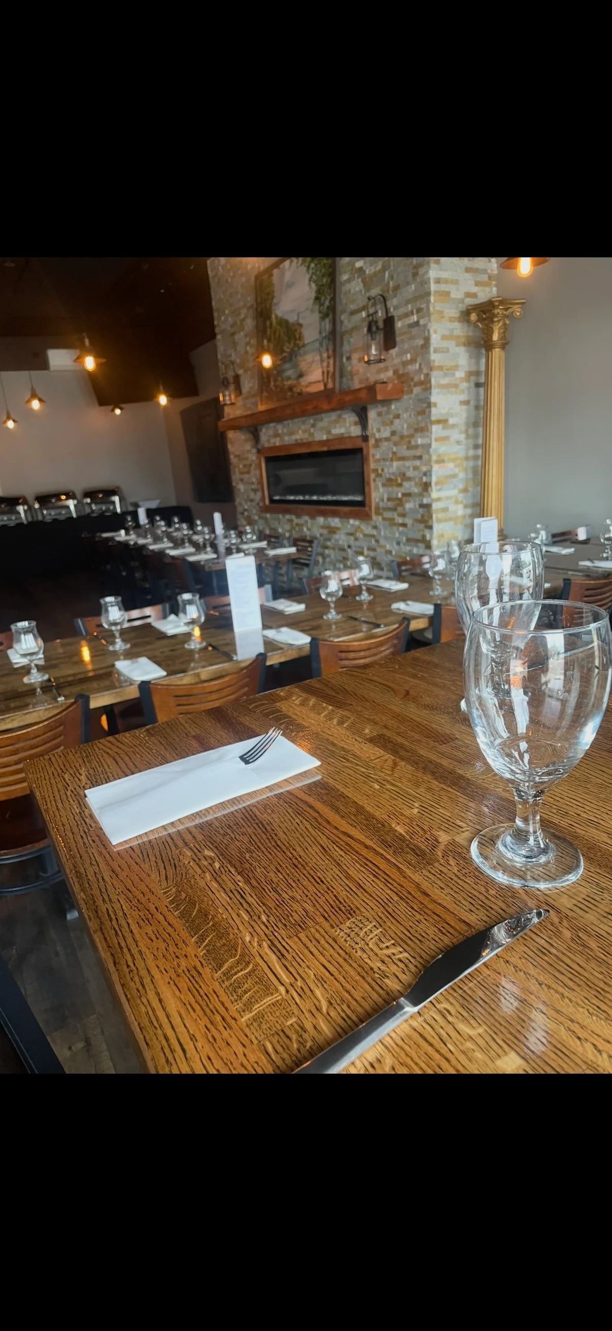 Modern restaurant interior with stylish decor and seating arrangements.