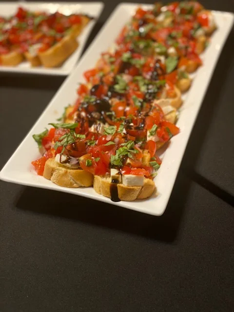 Bruschetta with fresh tomatoes and basil drizzled with balsamic glaze