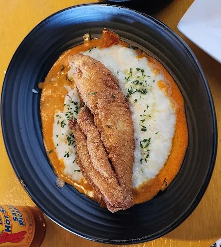 Southern-style catfish with grits and a biscuit