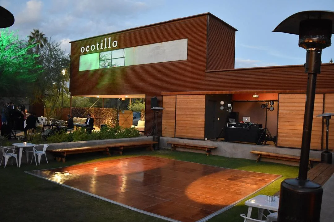Modern restaurant exterior with outdoor seating and event space