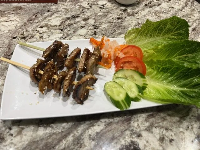 Vietnamese grilled pork skewers with fresh vegetables