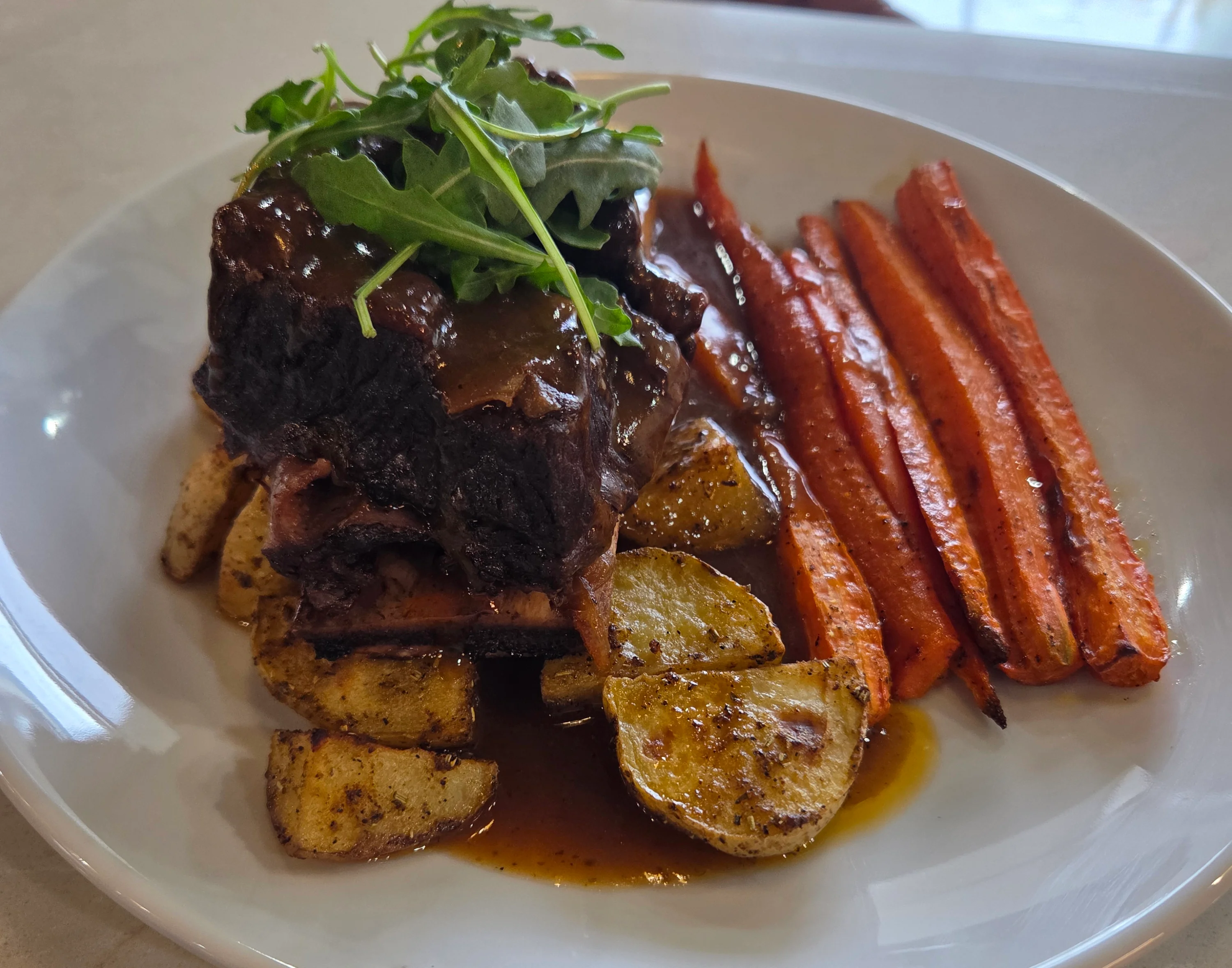 Braised beef short ribs with roasted vegetables