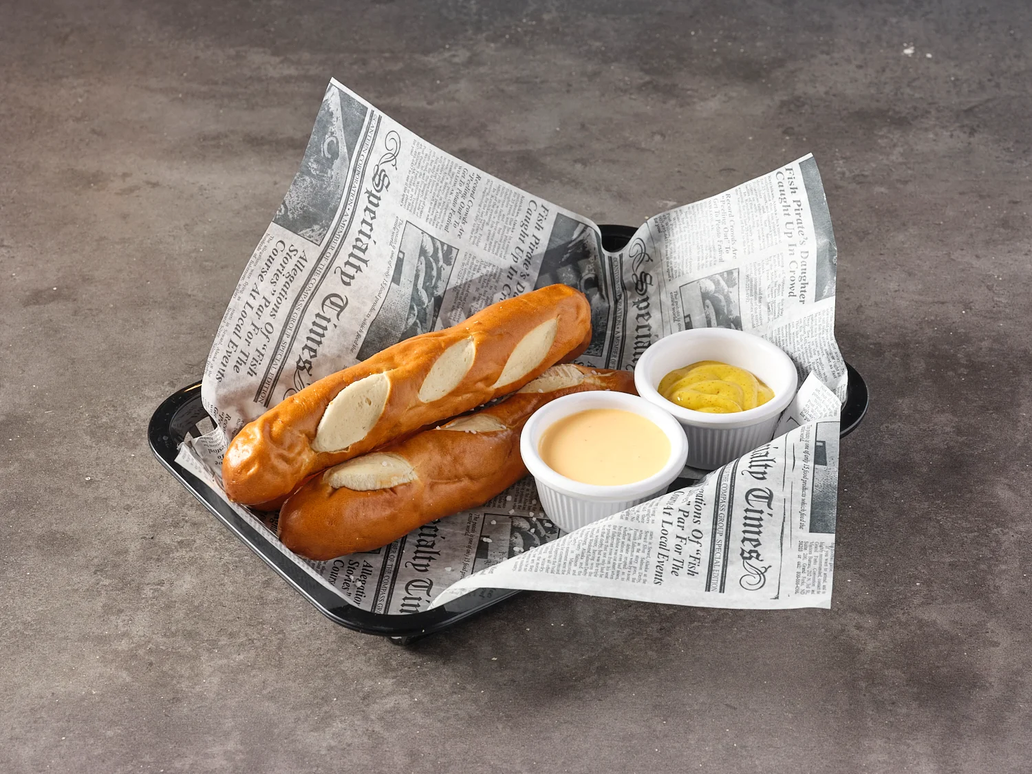 Soft pretzel sticks with cheese and mustard dipping sauces