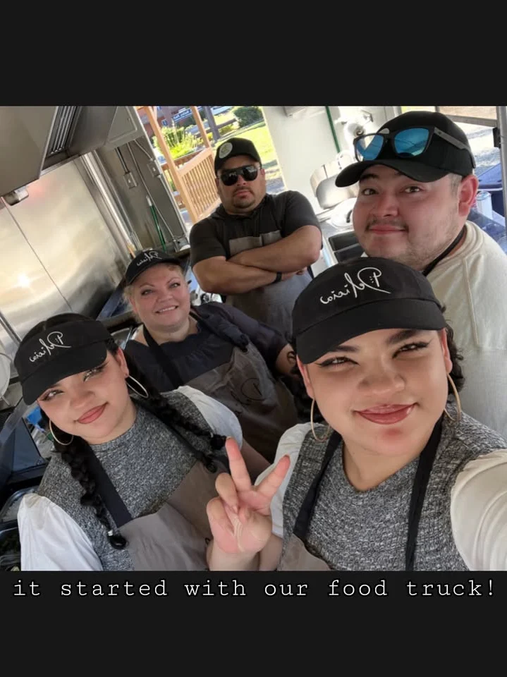 Team of food truck staff smiling together