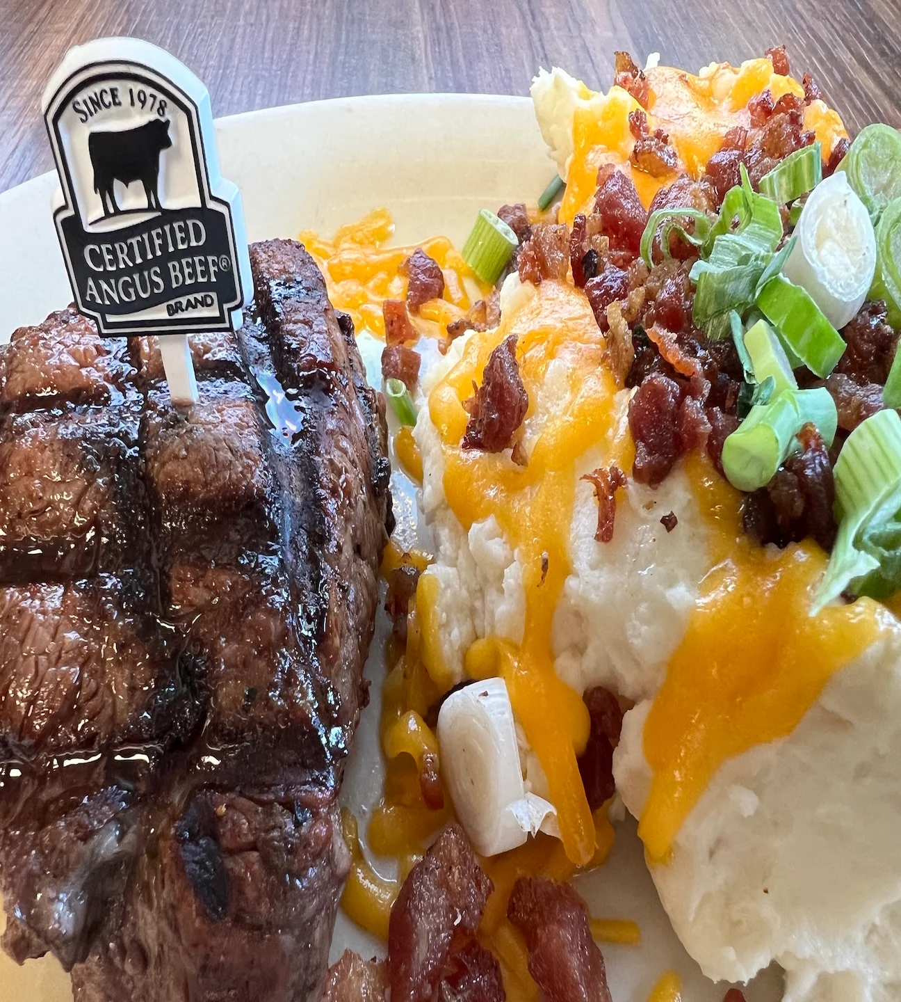 Grilled Angus steak with loaded mashed potatoes