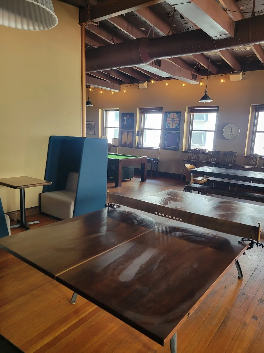 Cozy restaurant interior with wooden tables and warm lighting