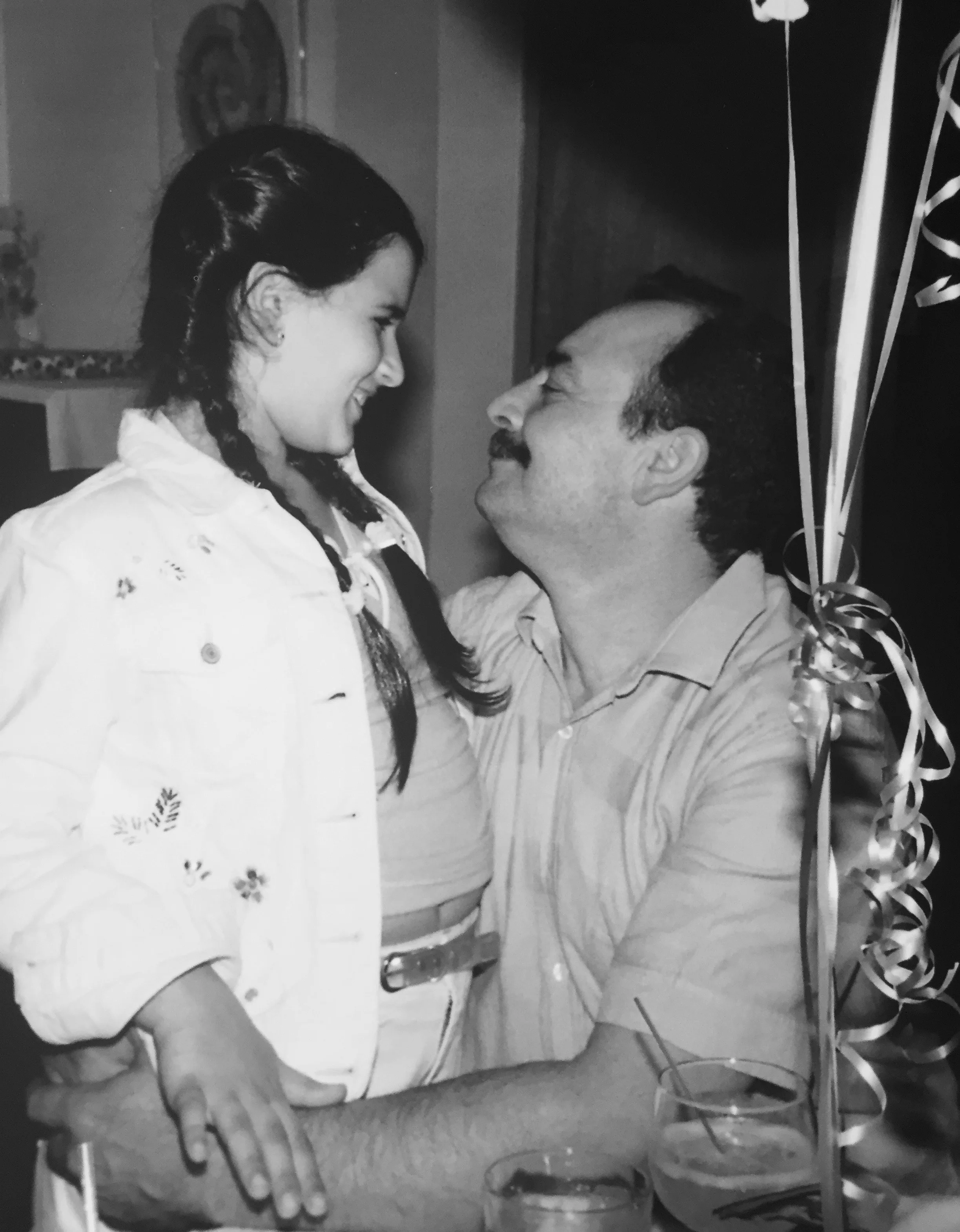 Heartwarming moment between a father and daughter at a celebration