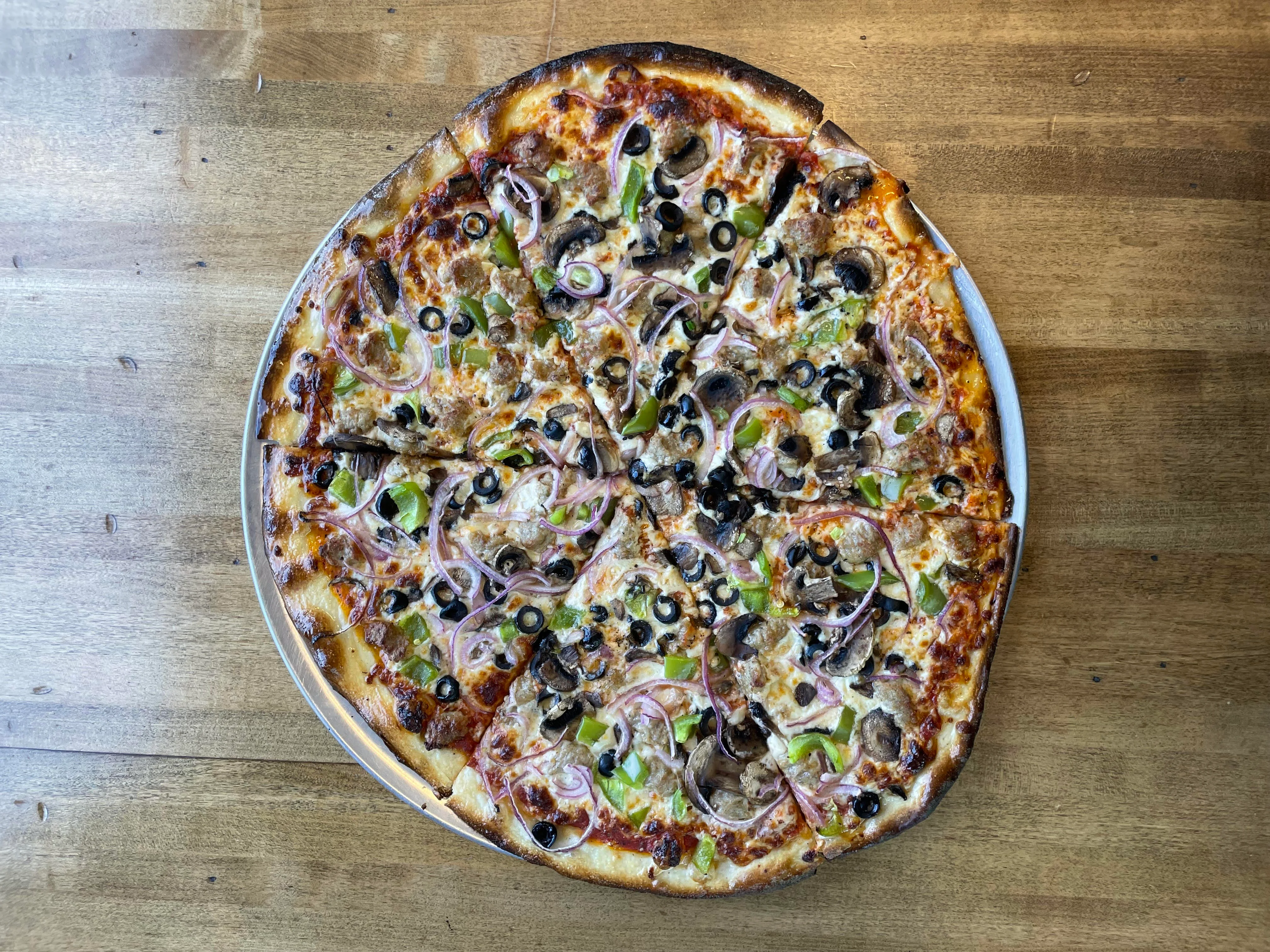 Delicious vegetarian pizza with olives and mushrooms