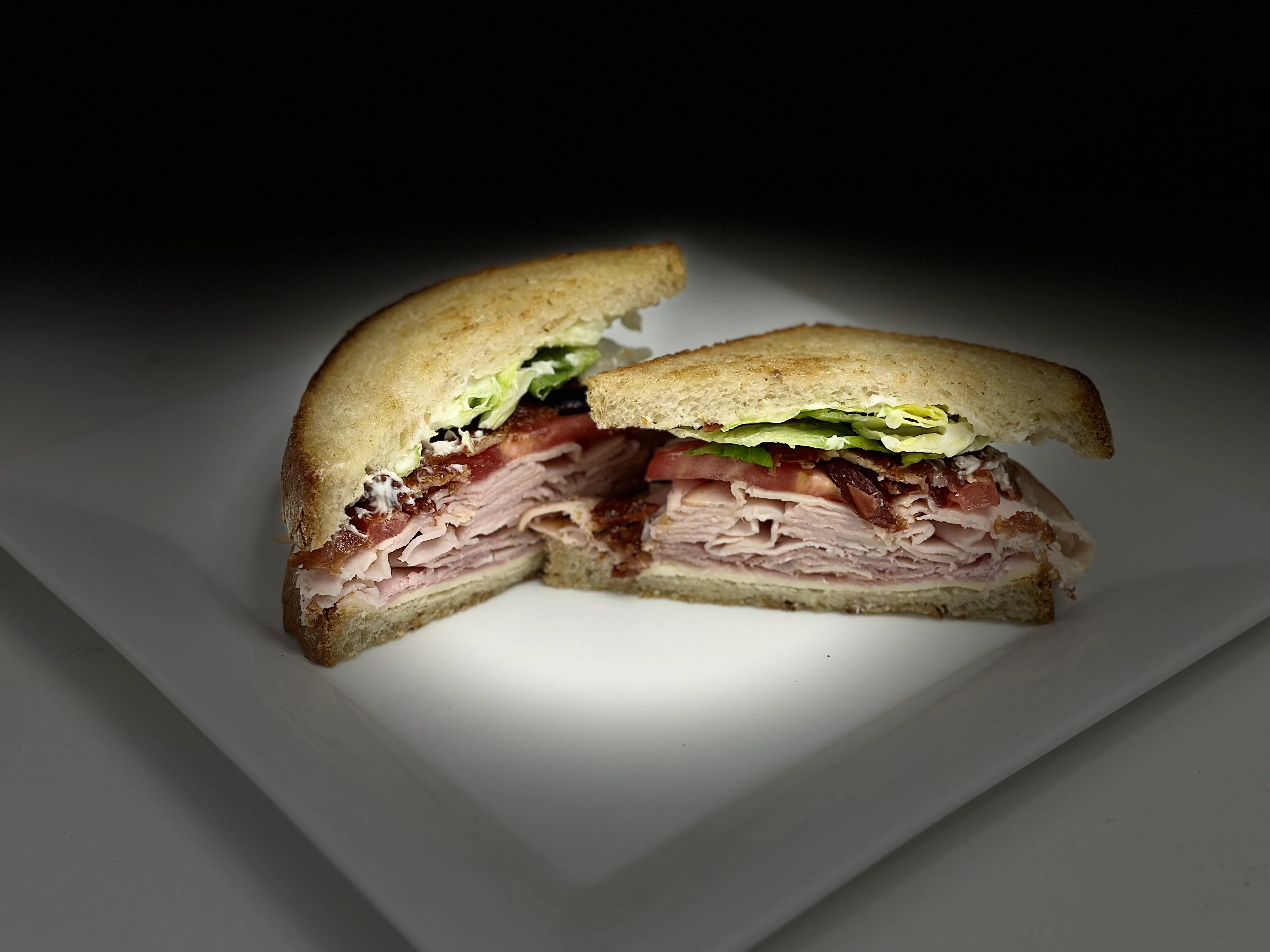 Classic deli sandwich with layers of meats and fresh vegetables