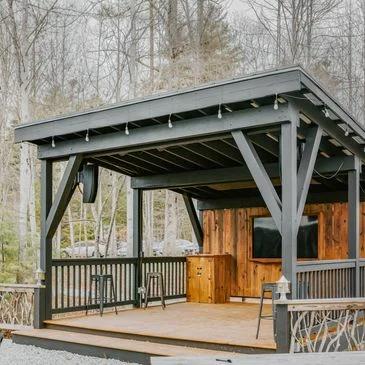 Outdoor dining pavilion with wooden accents and seating