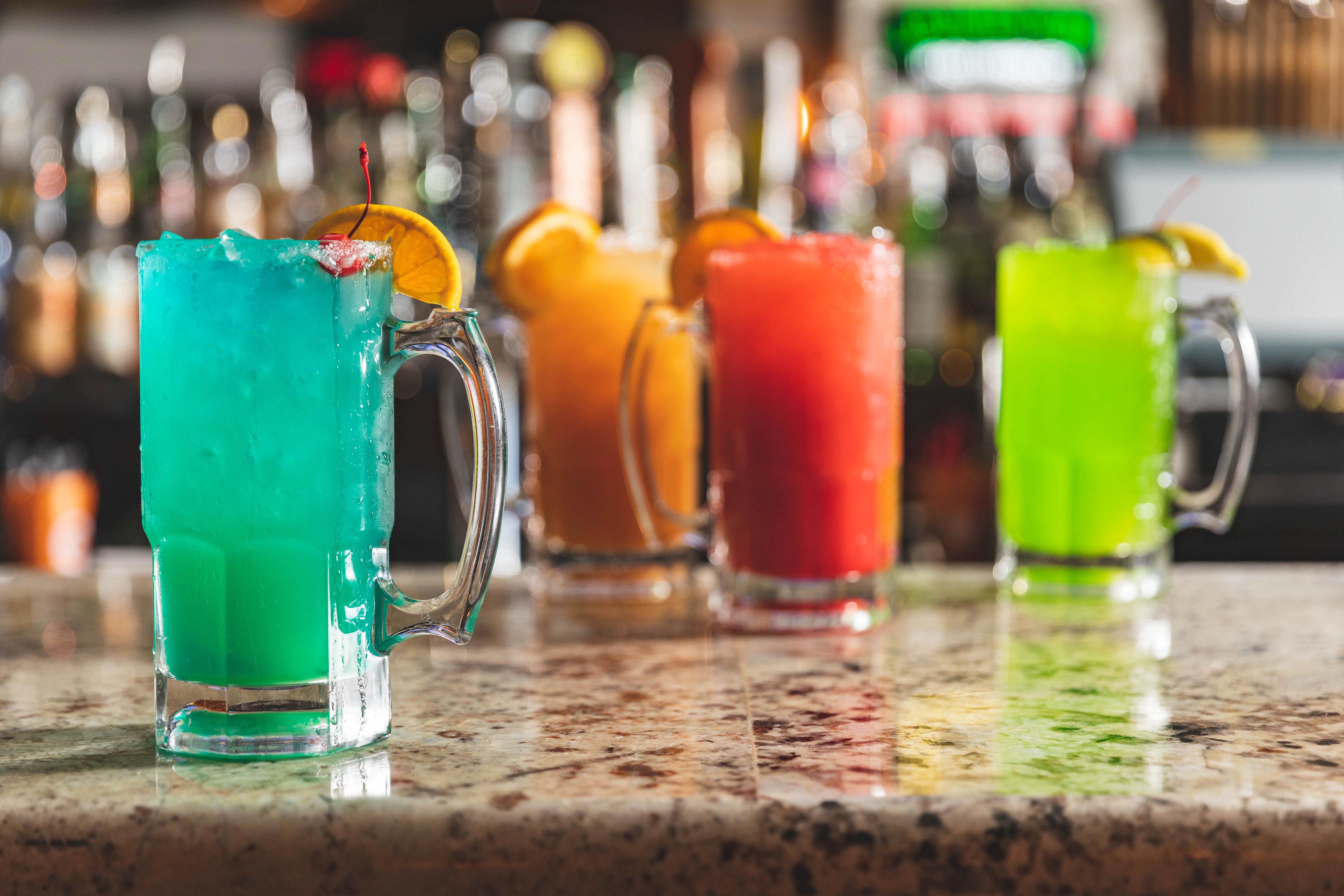 Colorful cocktails in mason jars at a vibrant bar
