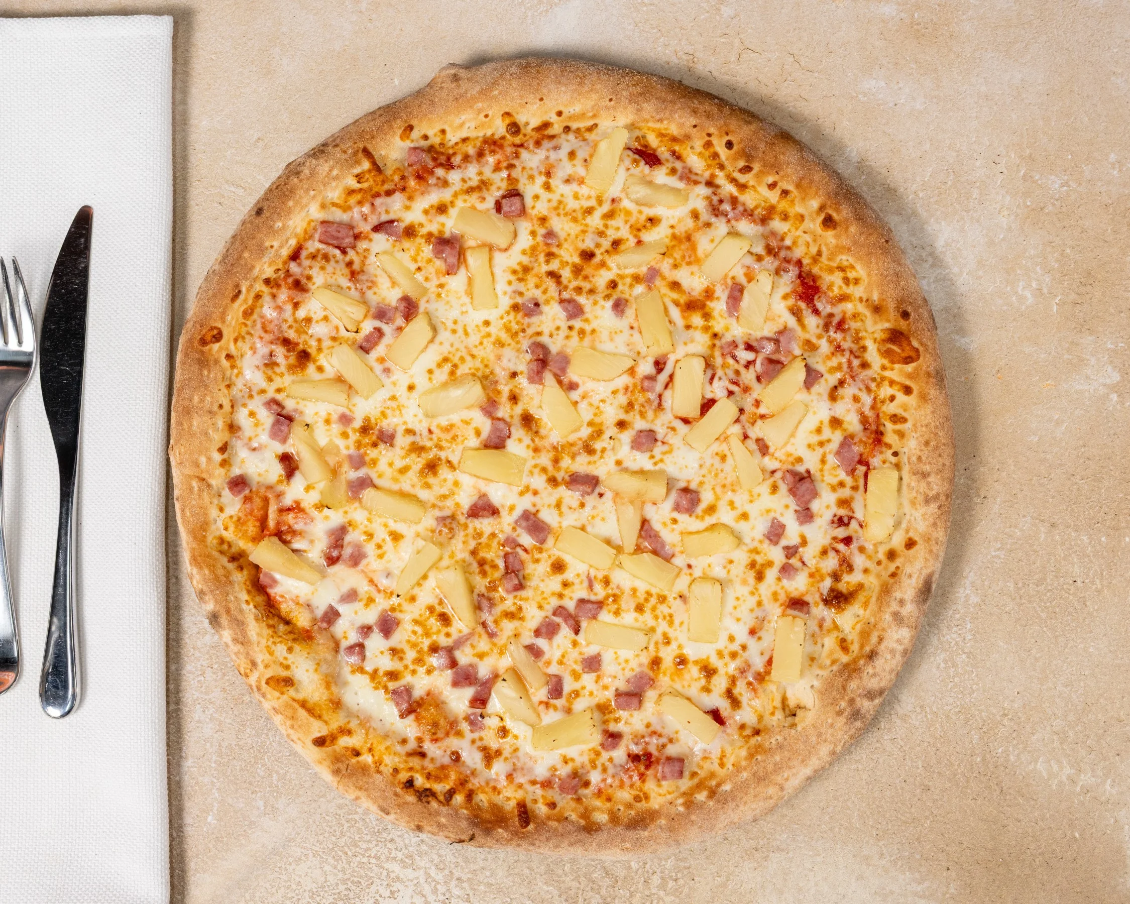 Hawaiian pizza with ham and pineapple