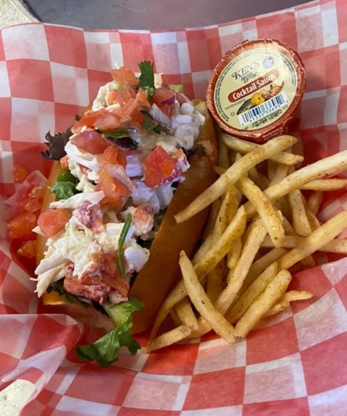 Lobster roll with fries and cocktail sauce
