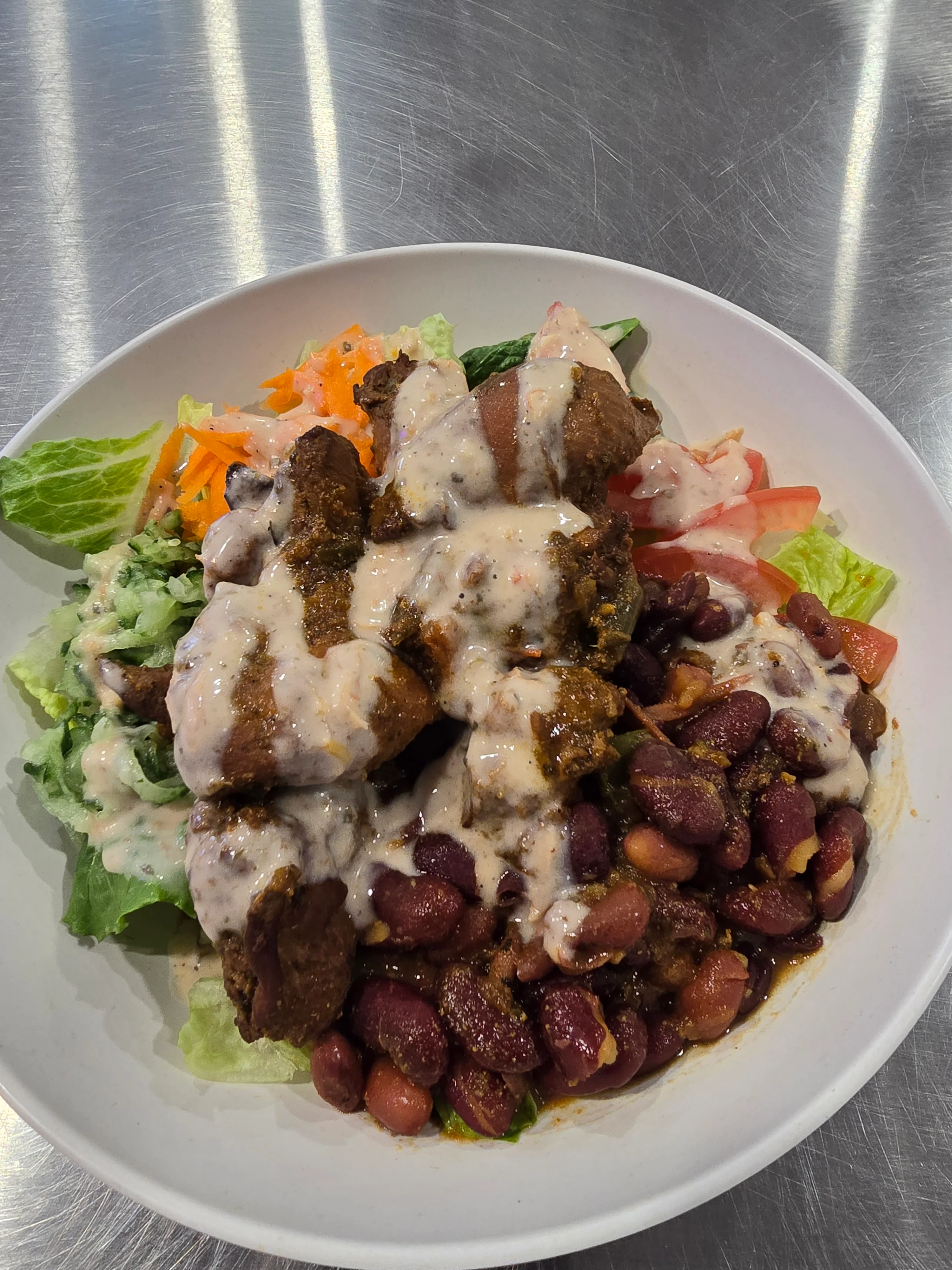Savory chicken salad bowl with beans and creamy dressing