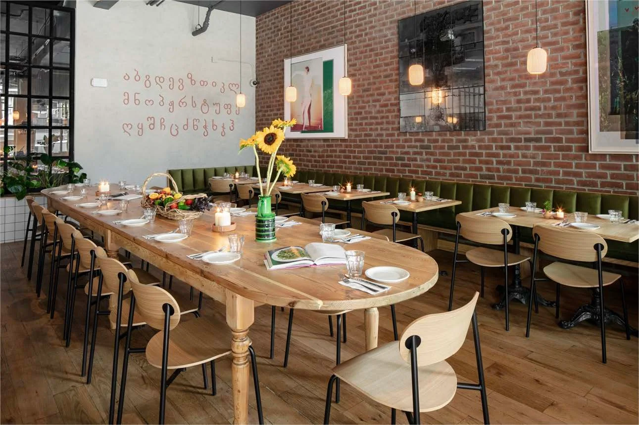Cozy restaurant interior with wooden tables and warm lighting