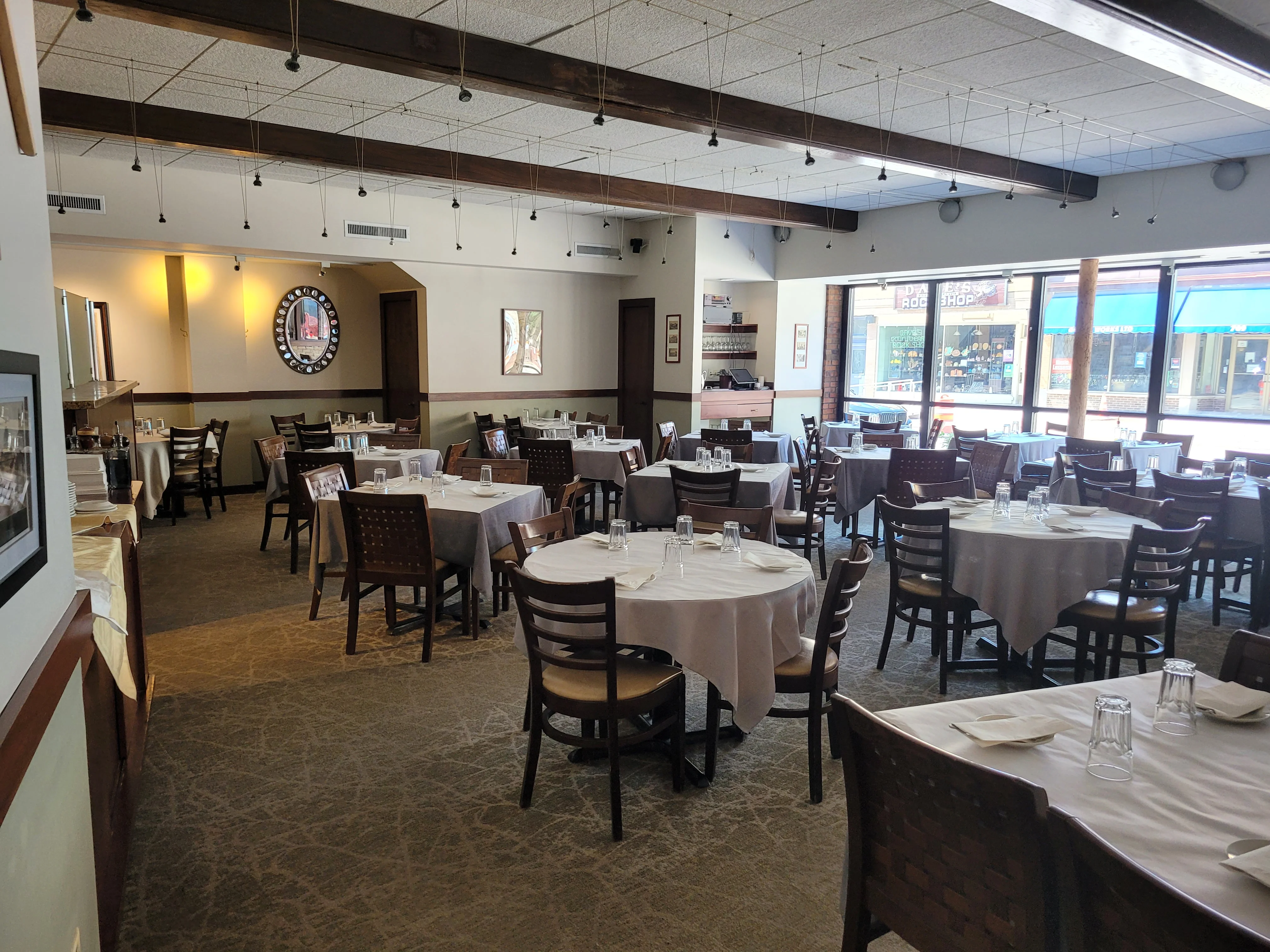 Cozy restaurant interior with tables and warm lighting