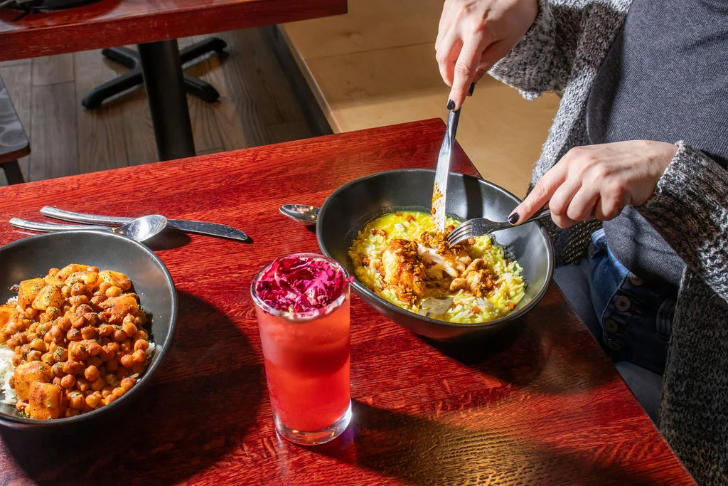Flavorful Indian biryani served with a refreshing drink