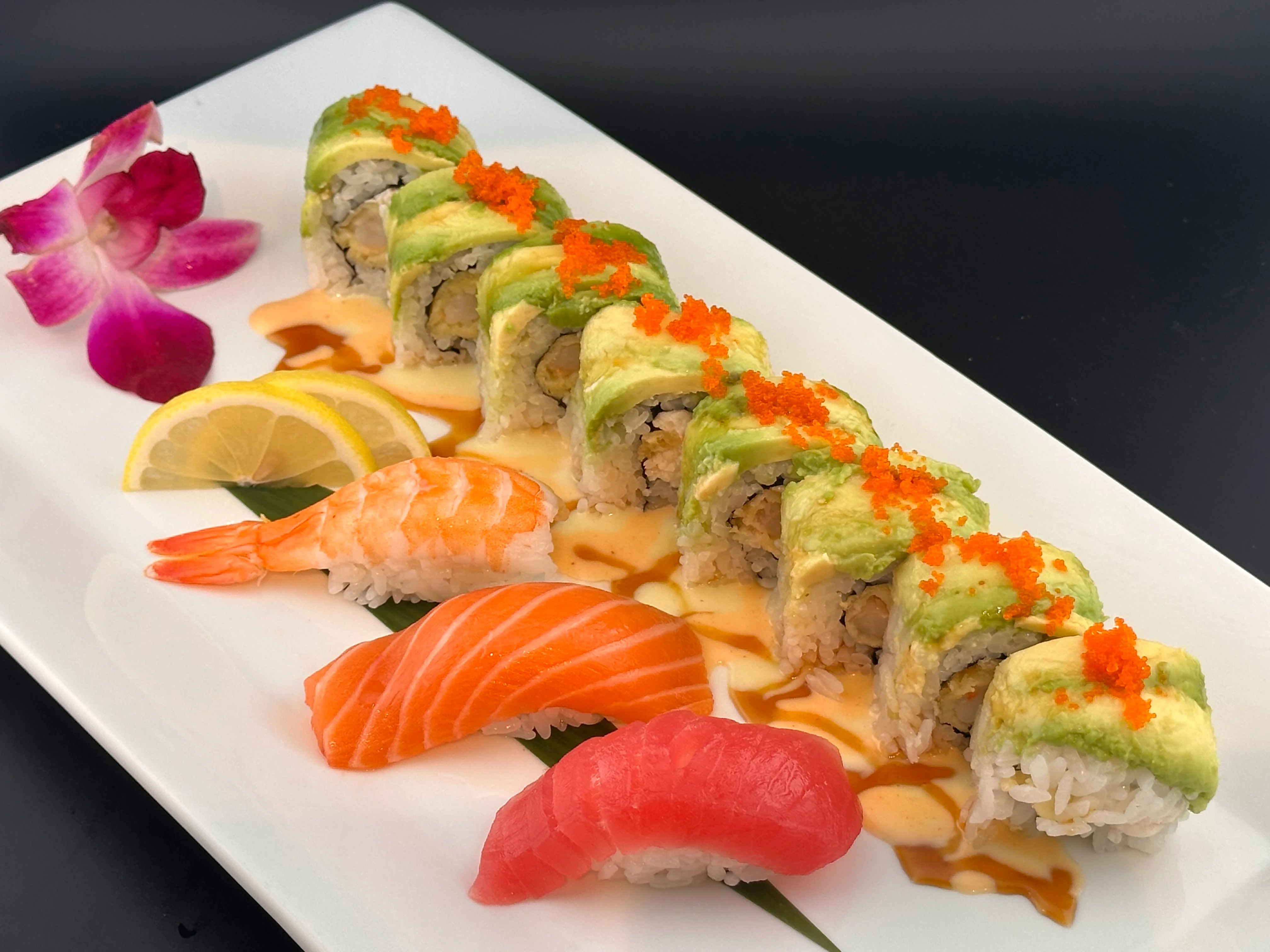 Japanese sushi platter with colorful rolls and fresh sashimi