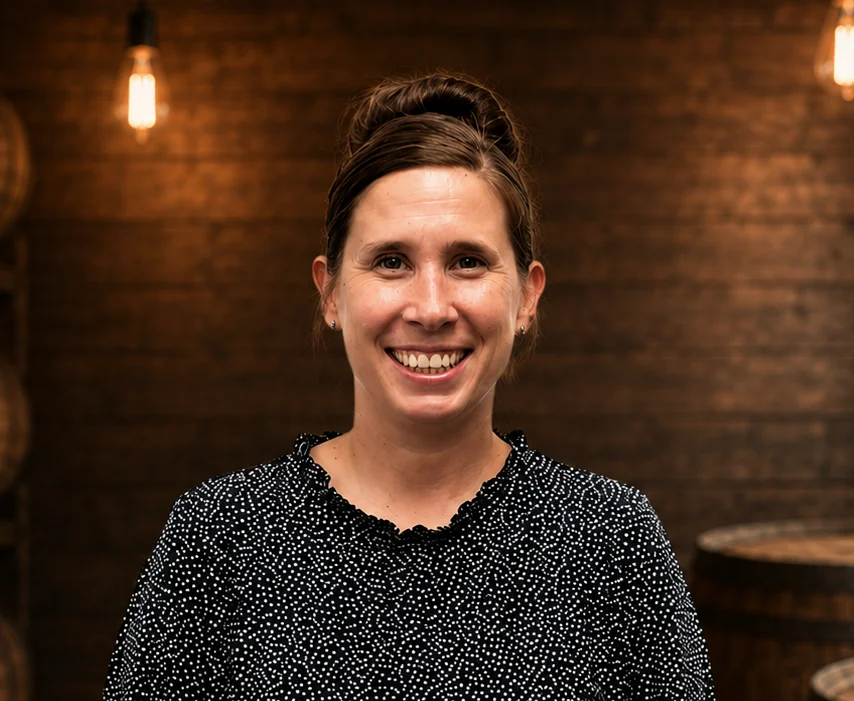 Professional woman smiling in a modern restaurant setting