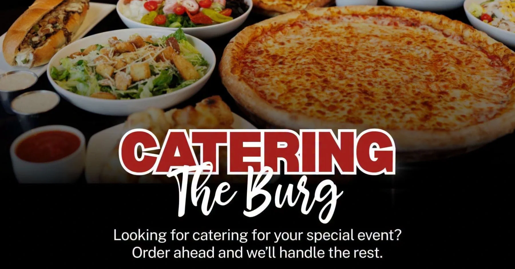 Catering spread featuring pizzas, salads, and sandwiches for events