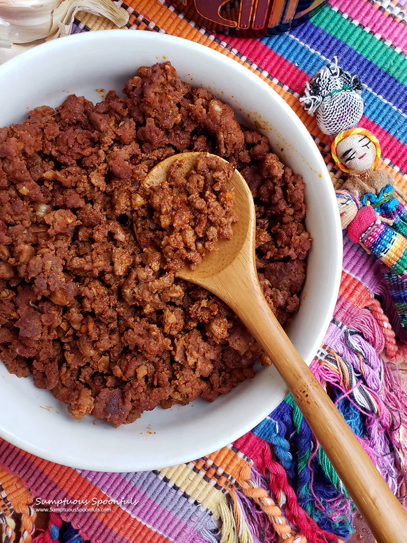 Mexican chorizo served in a bowl with a wooden spoon