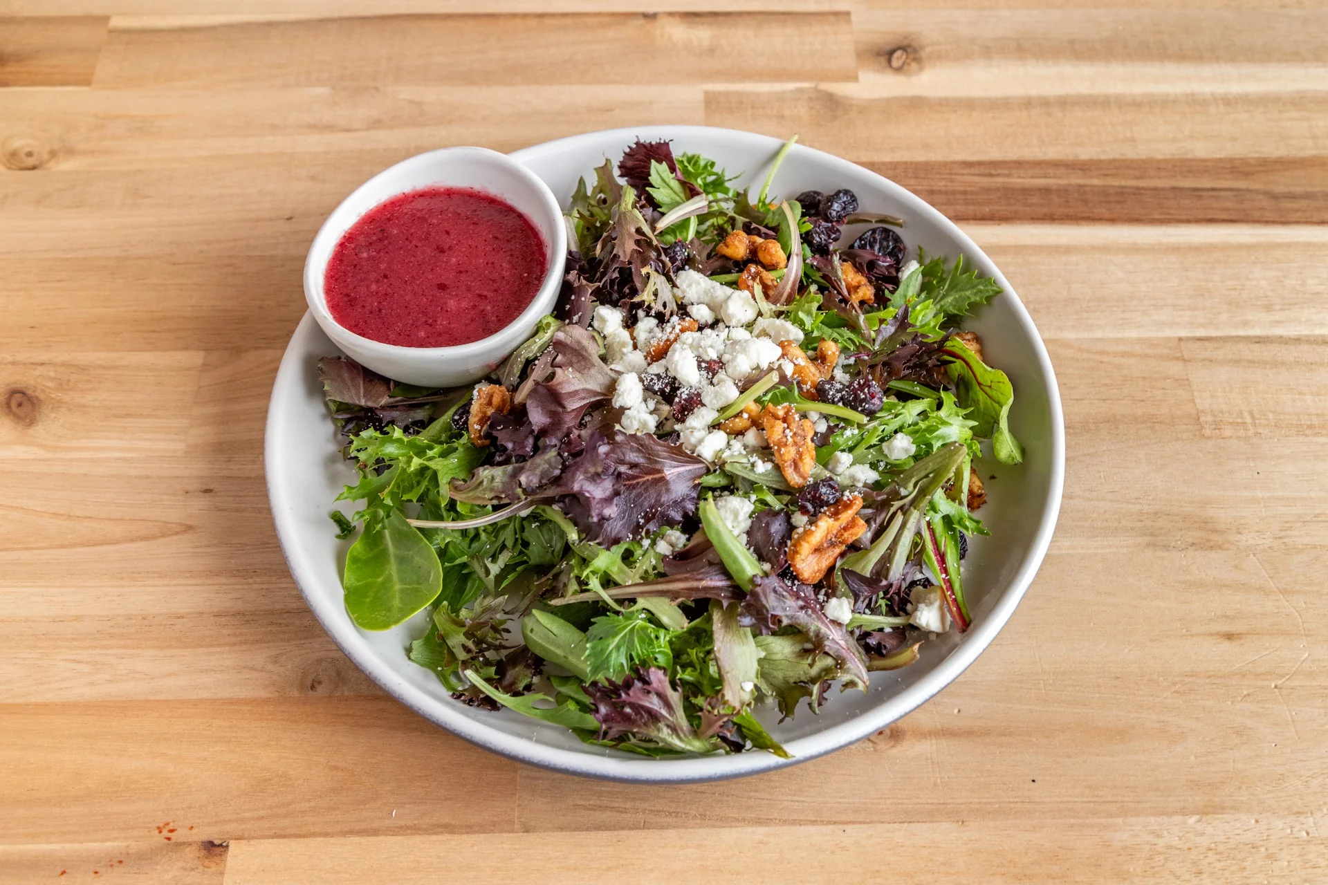 Fresh garden salad with berry vinaigrette dressing