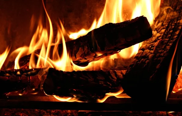 Crackling firewood burning in a cozy fireplace