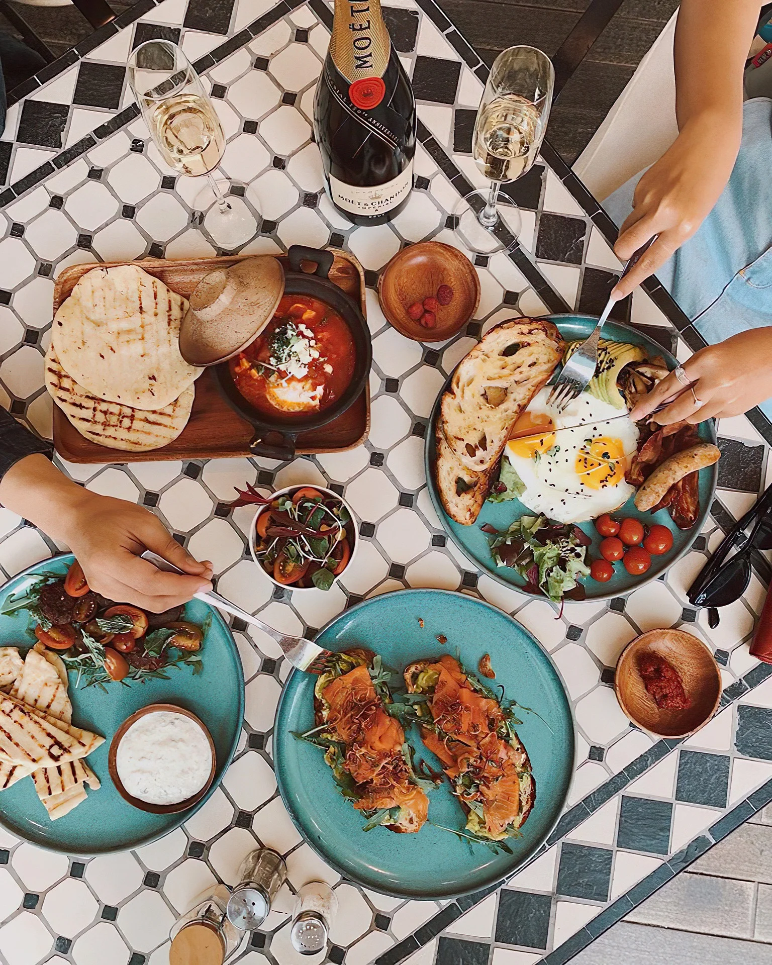 Brunch spread featuring Mediterranean shakshuka and smoked salmon toast