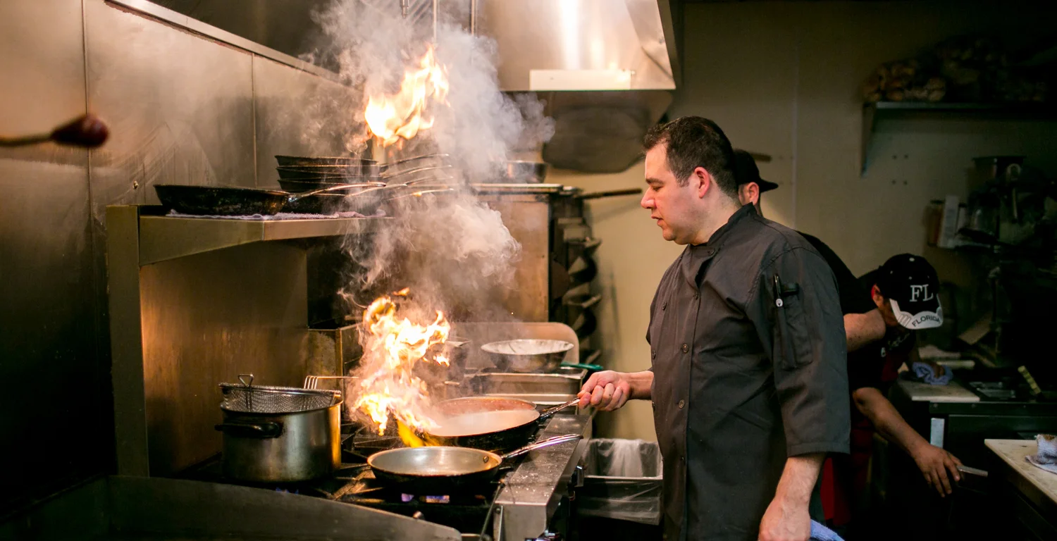 A restaurant chef preparing a dish