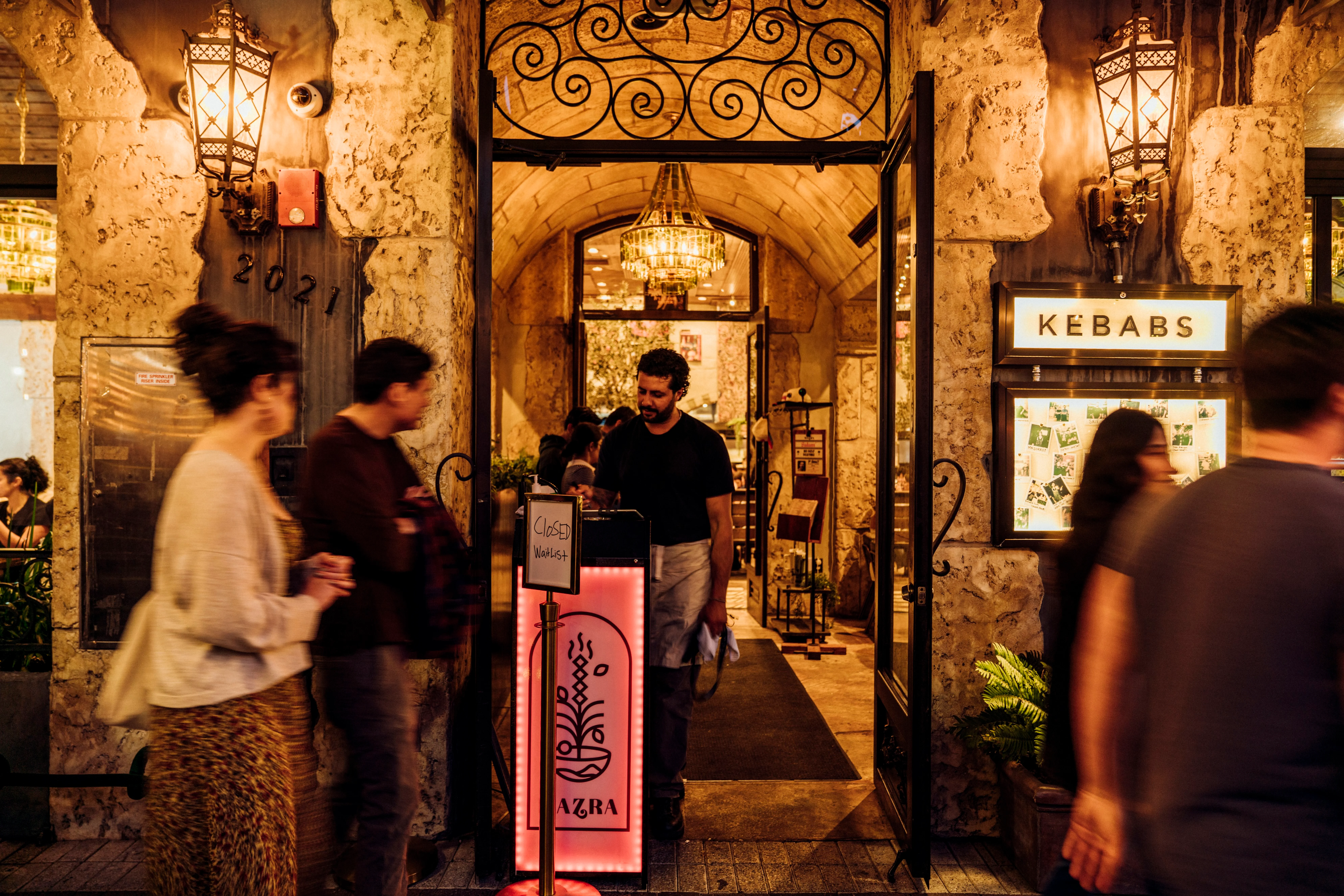 A restaurant entrance with host stand 