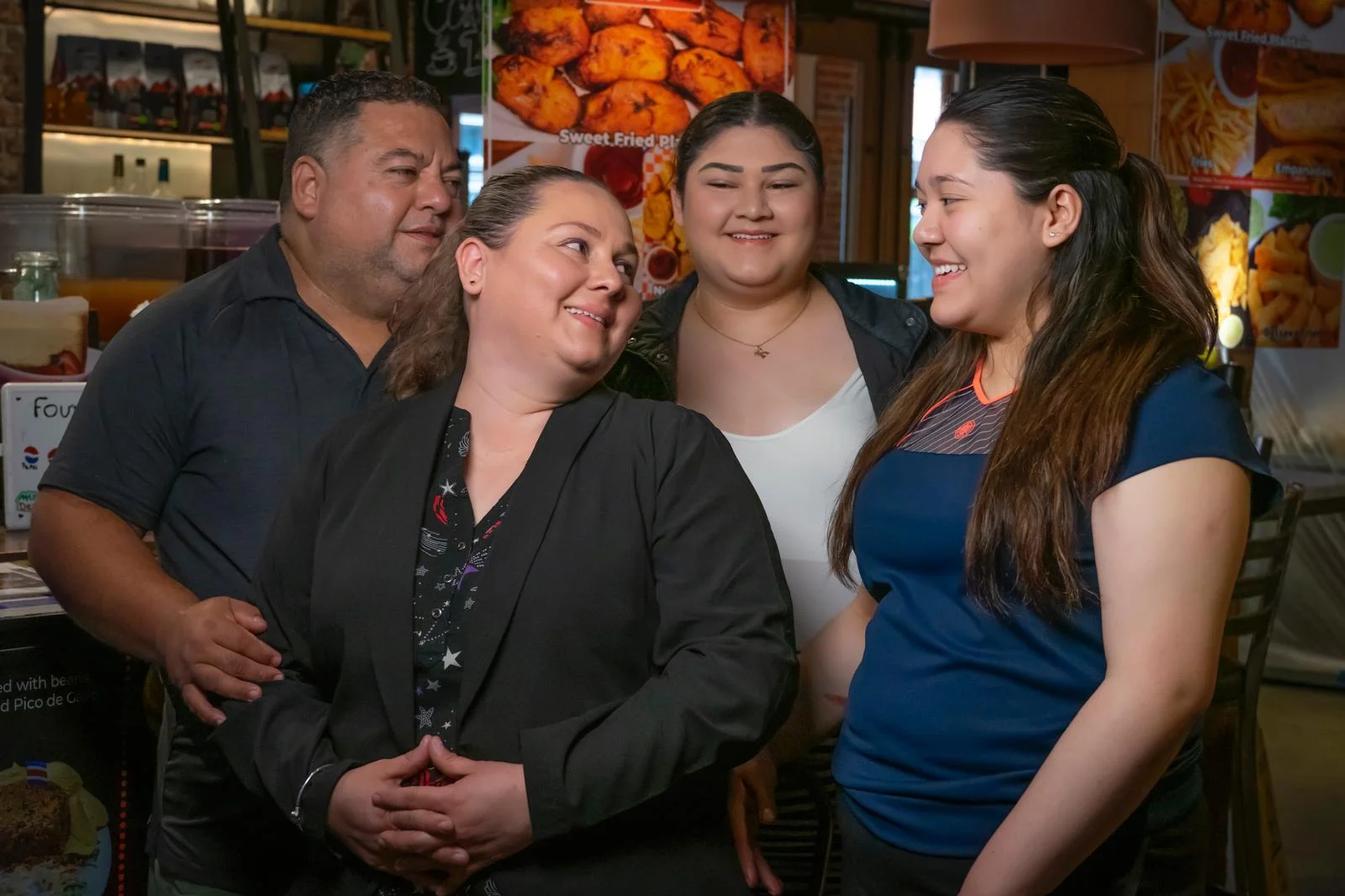 Friendly restaurant staff engaging with customers