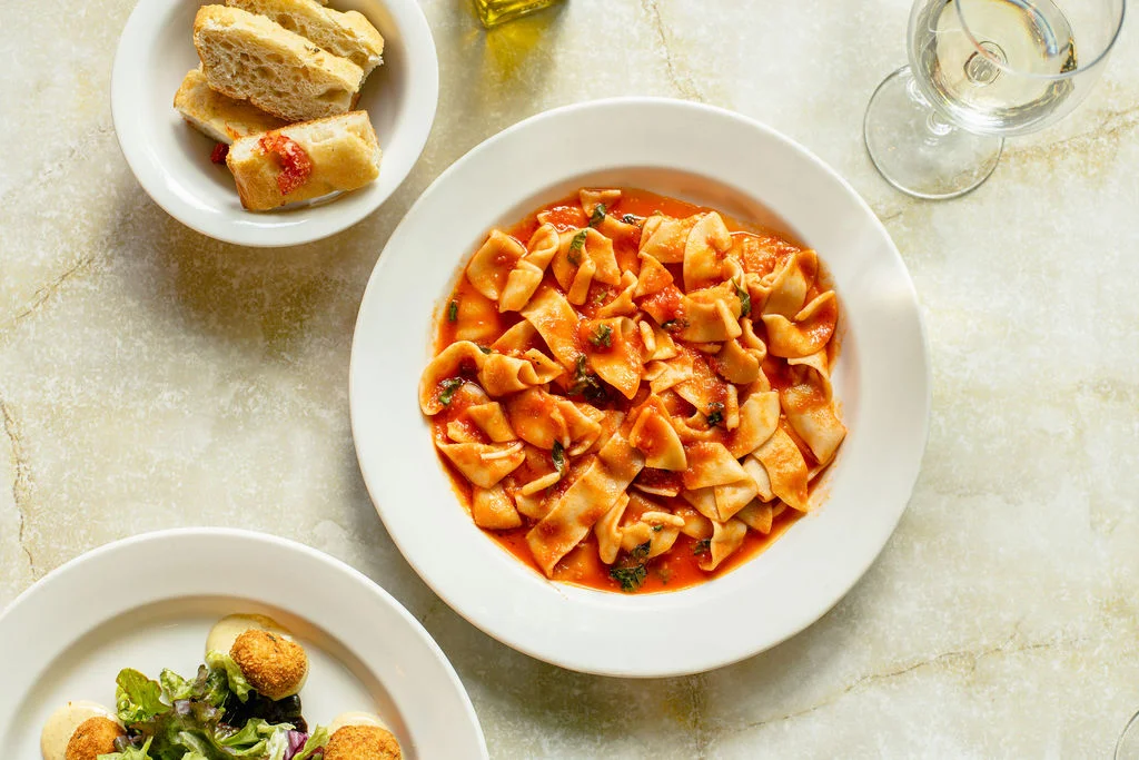 Plate of Italian pappardelle pasta in tomato sauce
