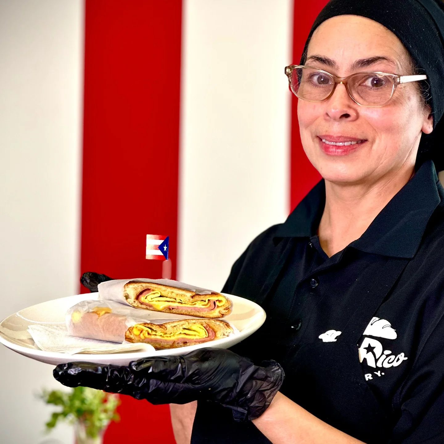 A woman with a plate of authentic Puerto Rican breakfast