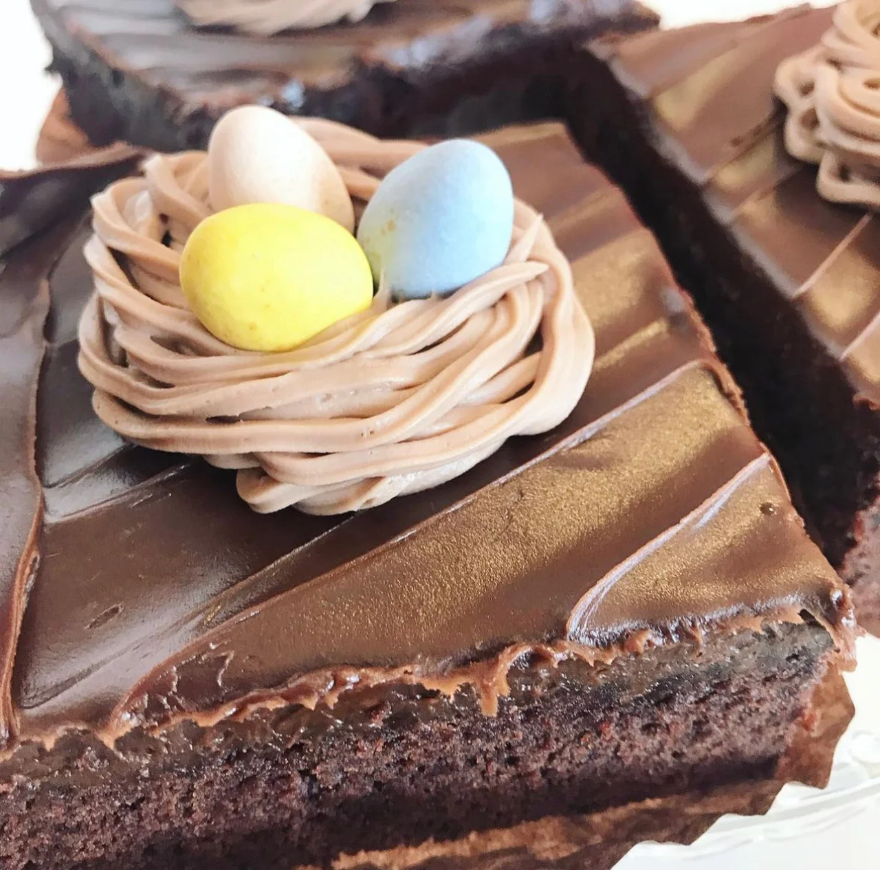 Easter-themed fudge brownie with chocolate frosting and candy eggs