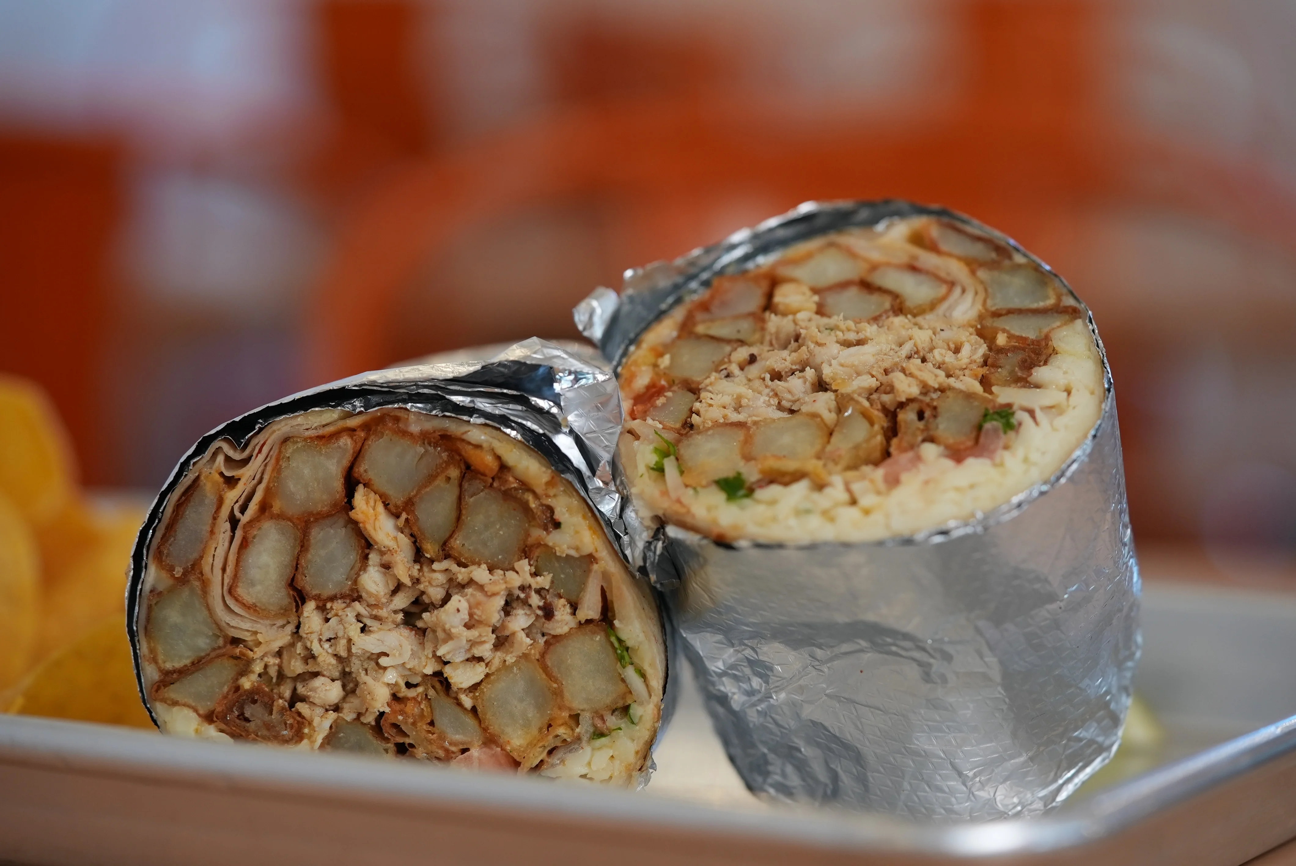 Loaded burrito with chicken and crispy potatoes