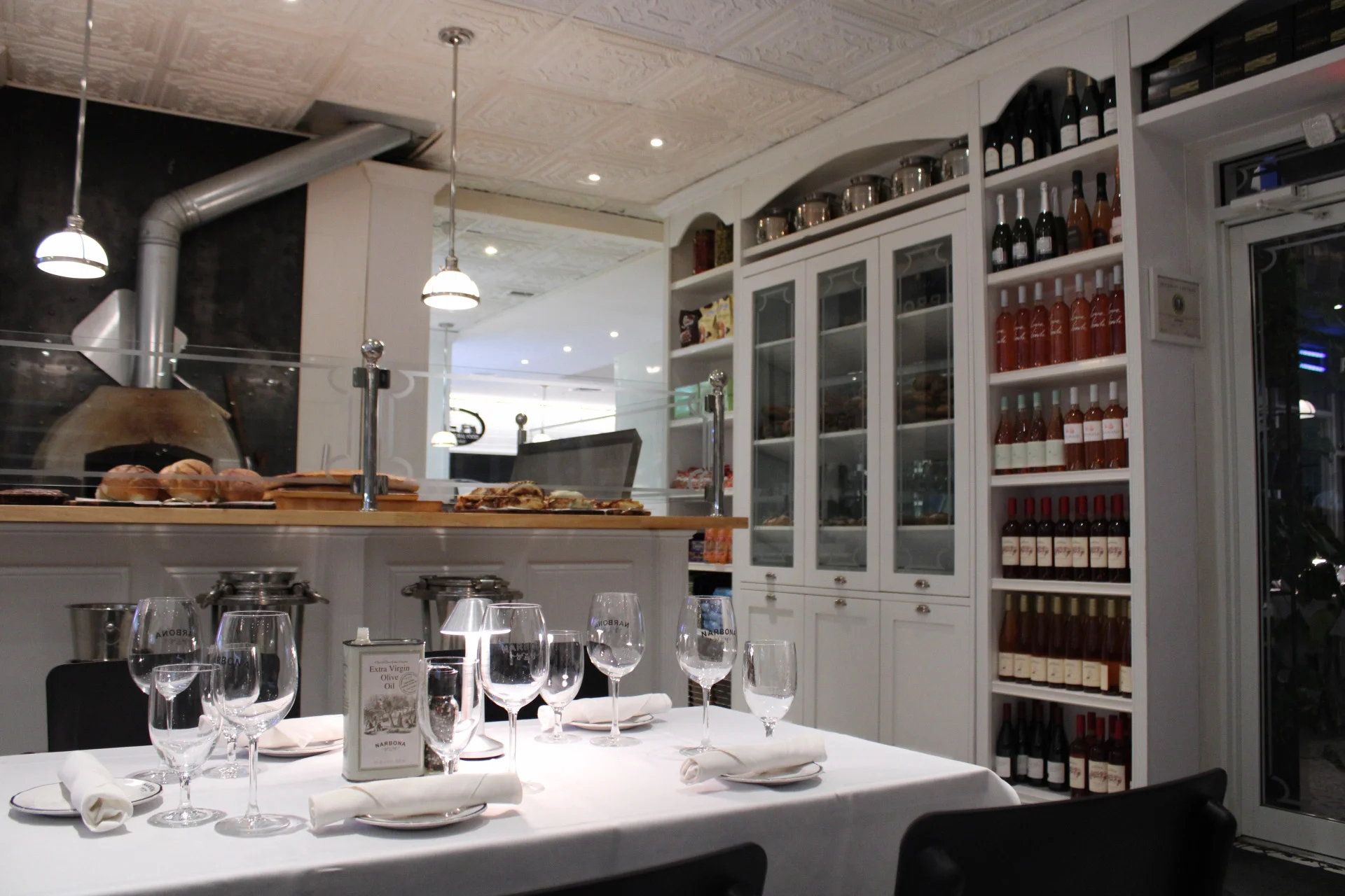 Elegant restaurant interior with wine display and dining setup