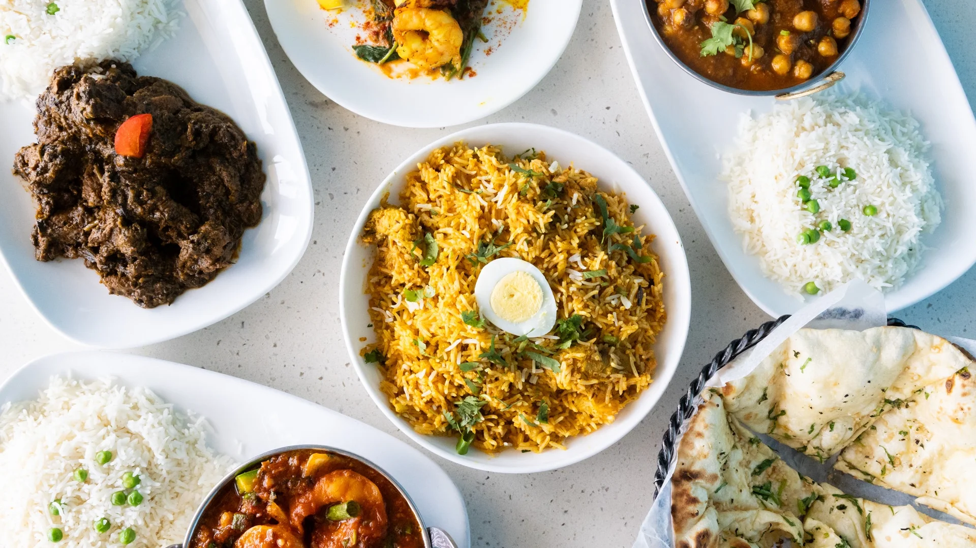 Assorted Indian dishes including biryani and curry