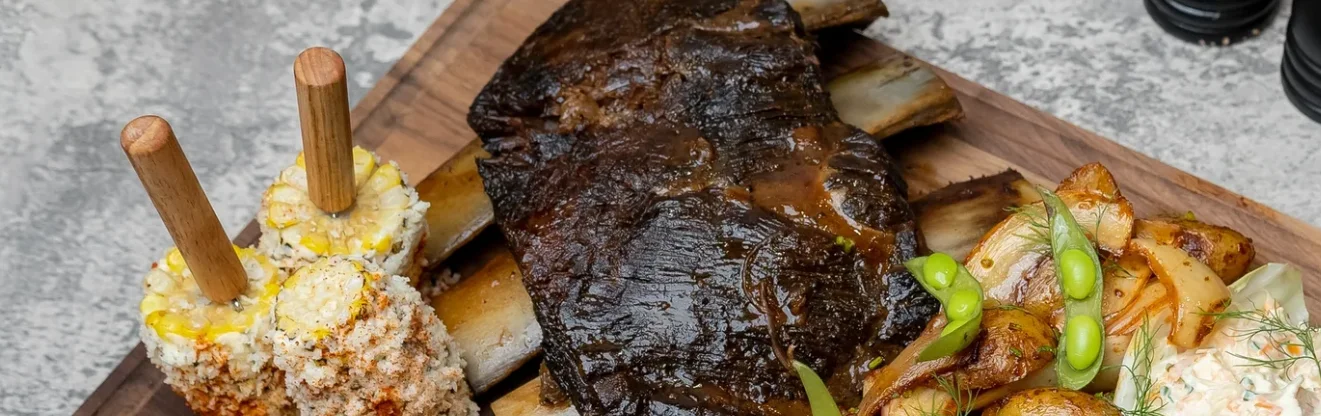 Smoky Texas-style beef ribs with grilled vegetables