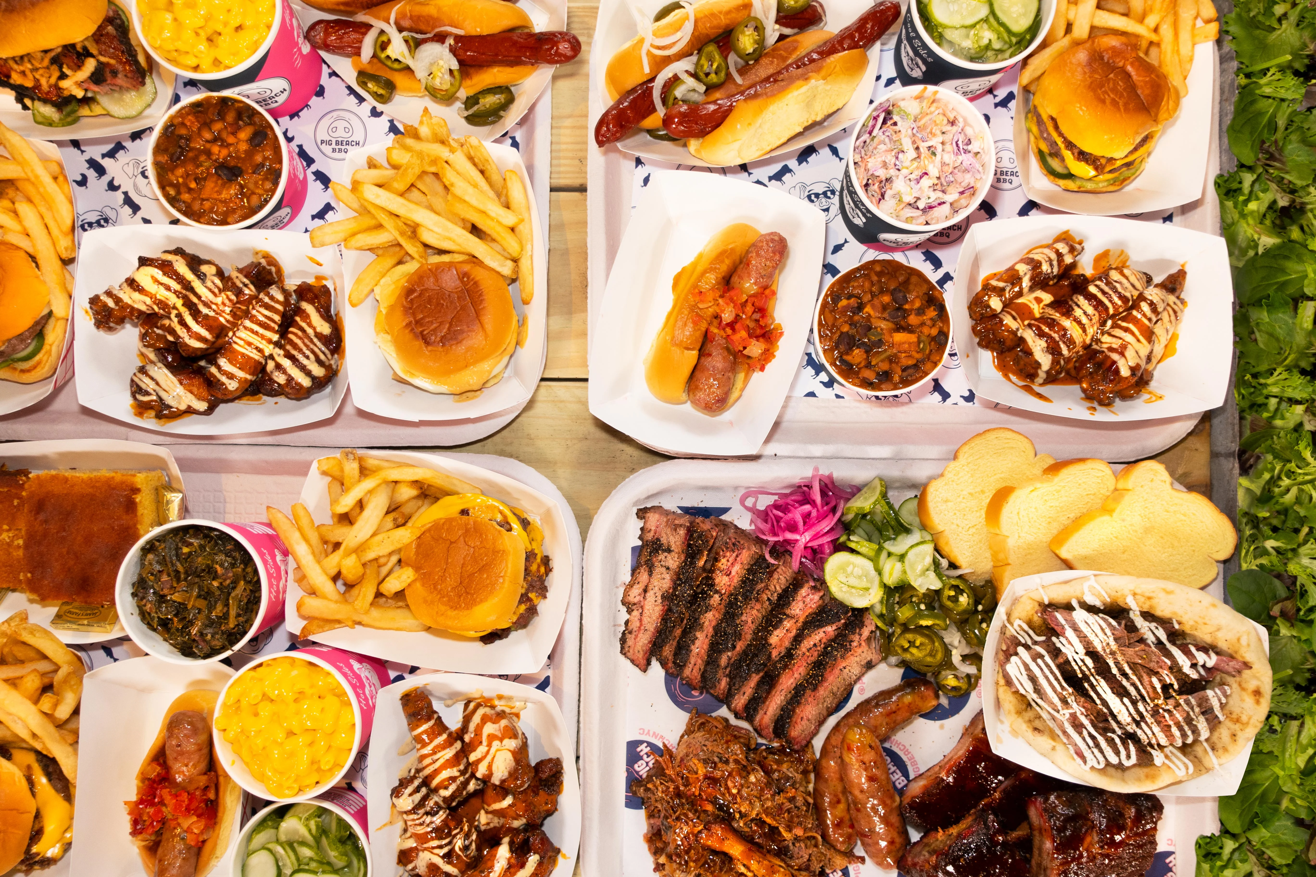 Assorted barbecue platter featuring ribs, brisket, and sausages