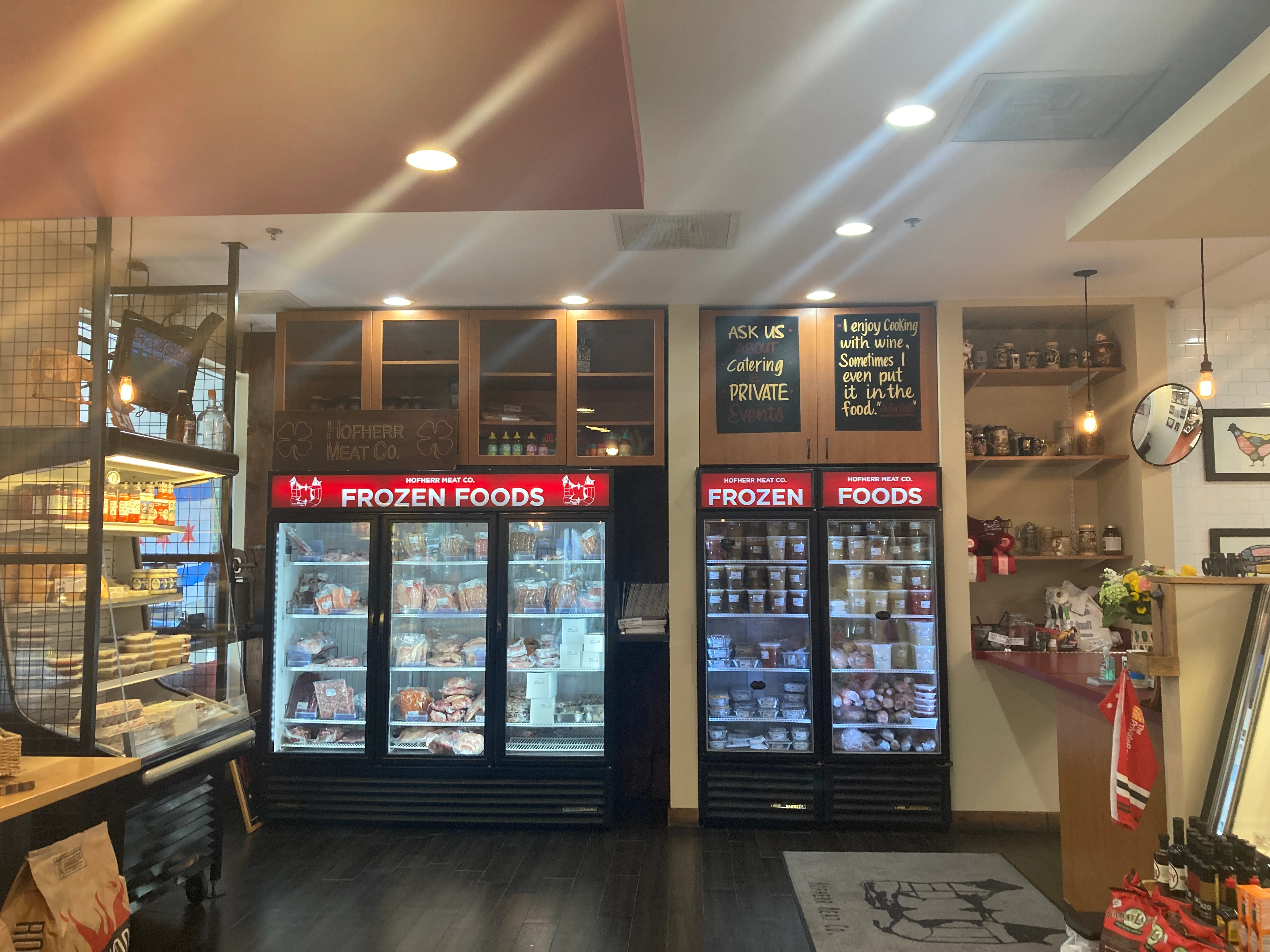 Interior of a restaurant showcasing frozen food displays and shelves.
