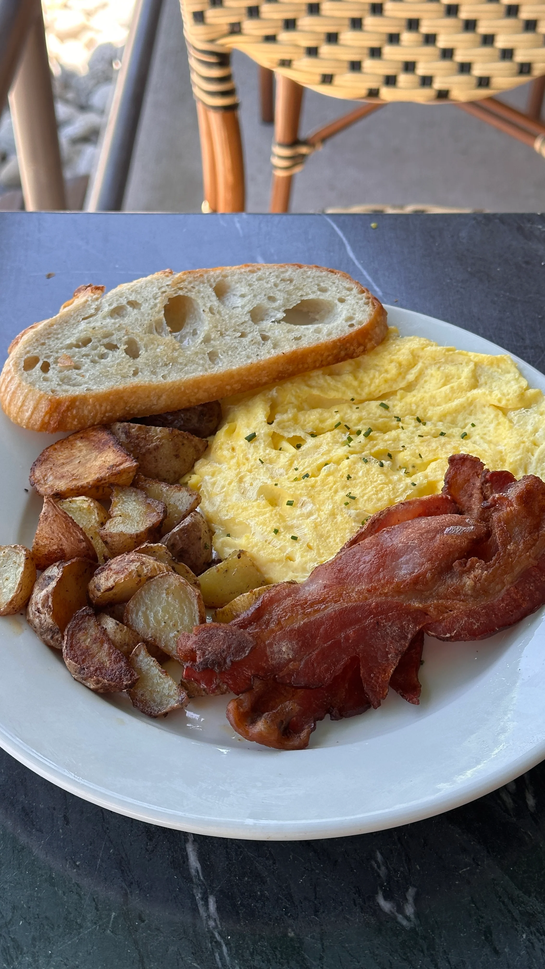 Classic American breakfast with omelette, bacon, and potatoes