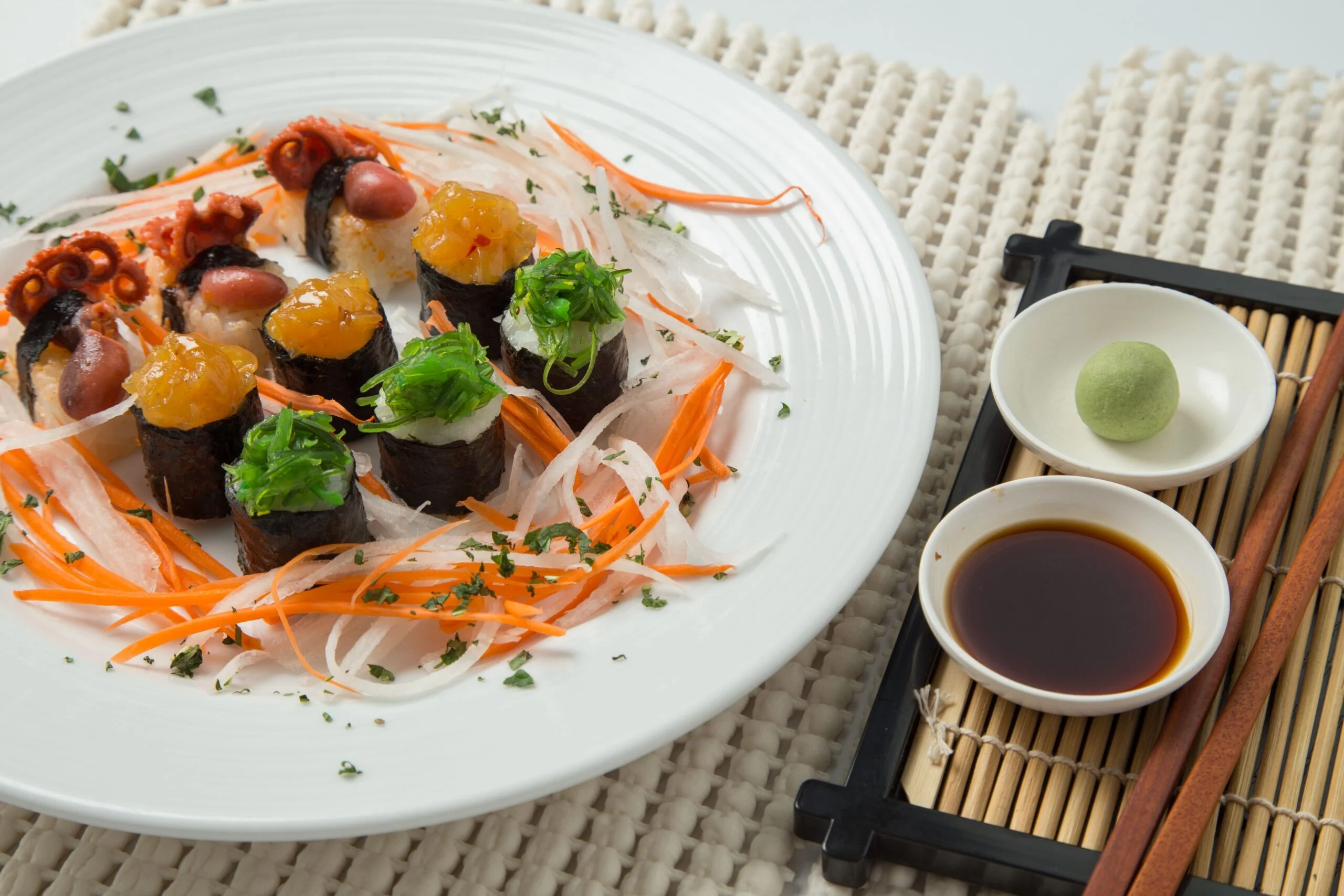 Japanese sushi platter with octopus maki, wasabi, and soy sauce