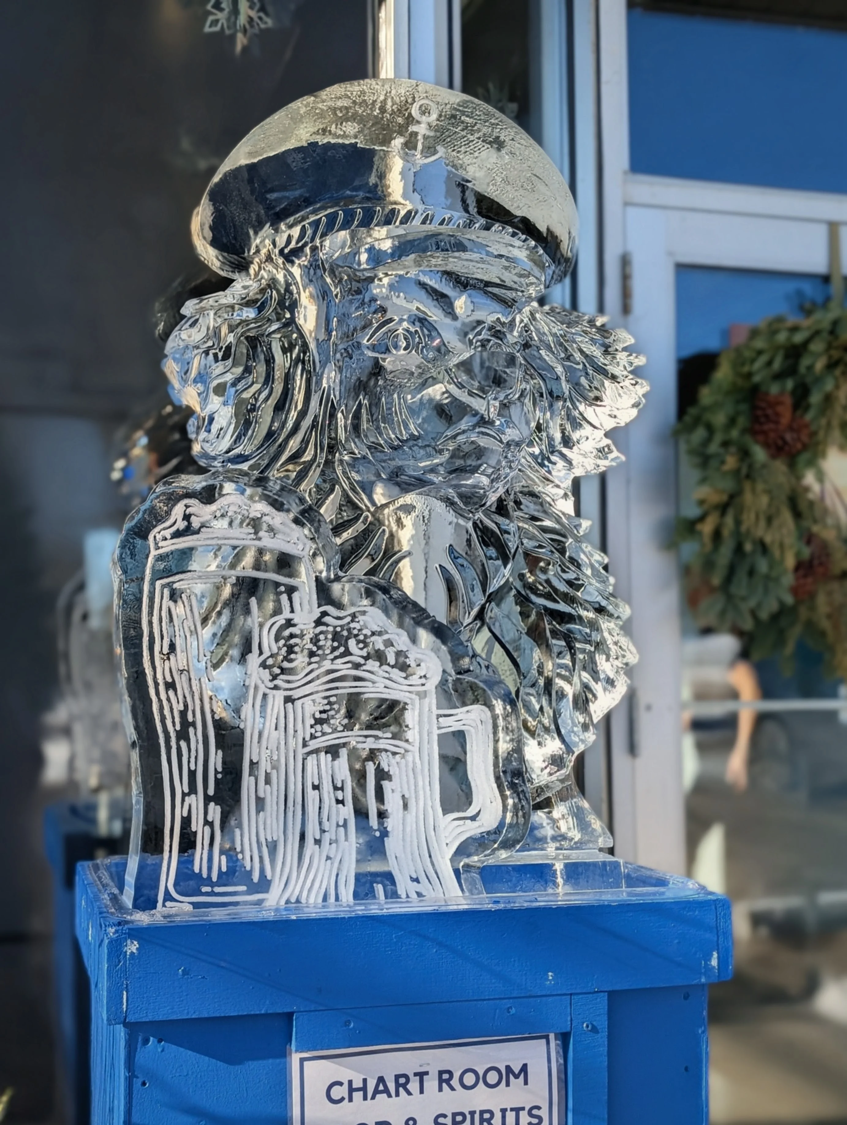Intricate ice sculpture of a lion captain with a beer mug