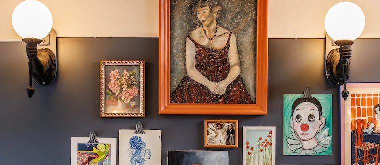 Art-filled restaurant interior with cozy seating
