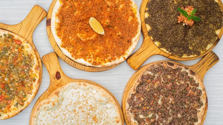 Assorted Lebanese manakish on wooden boards