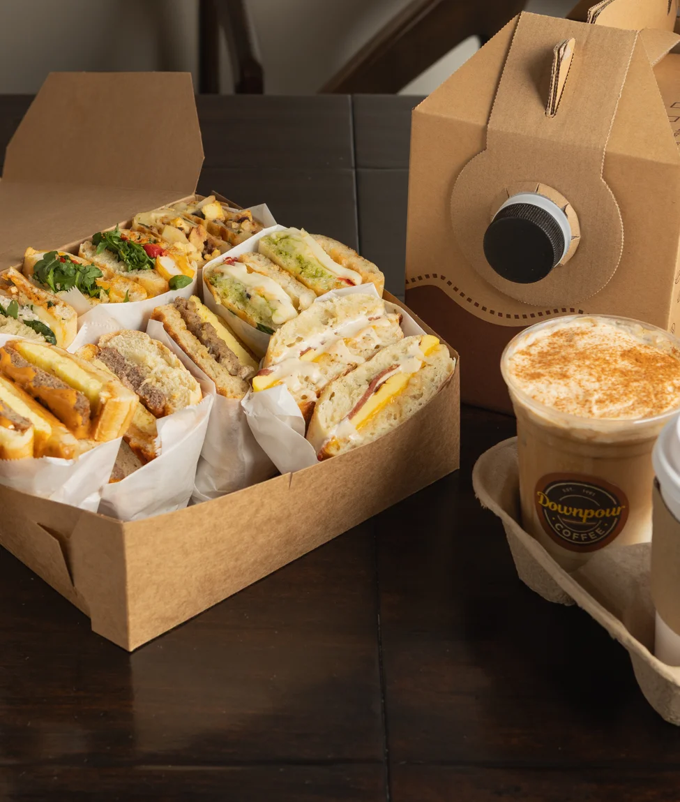 Assorted sandwiches and coffee from a café