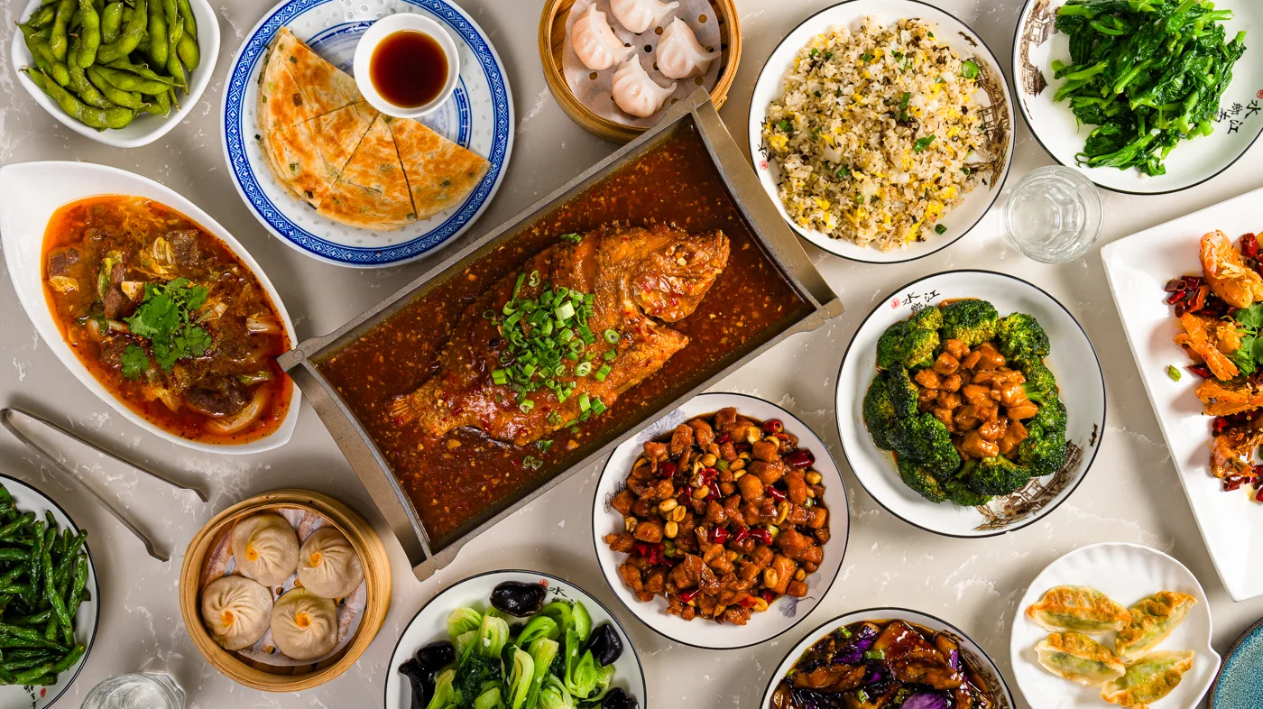 A beautifully arranged table with delicious food and drinks in a restaurant setting.