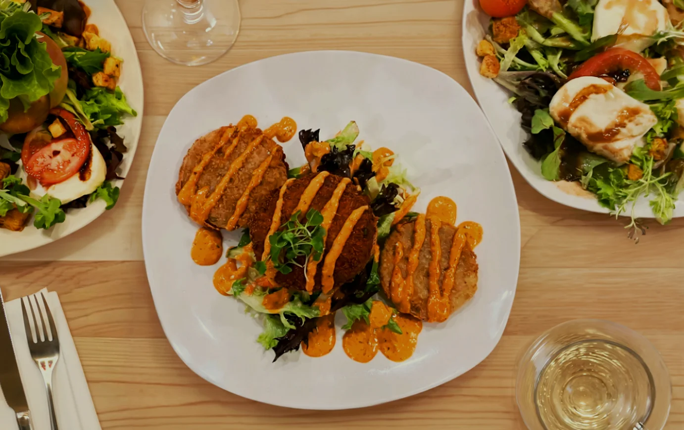 Delicious gourmet burger with fresh toppings on a wooden table