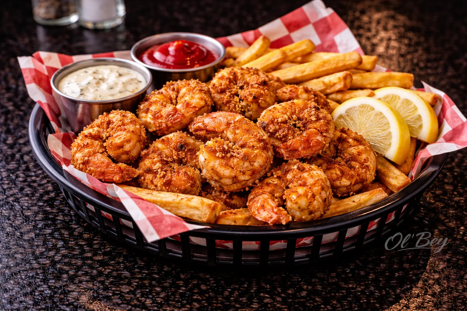 Crispy fried shrimp basket with fries and dipping sauces
